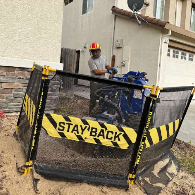stumo-grinding-in-process Skilled arborist precisely operating specialized equipment for efficient stump grinding on a residential property in sacramento